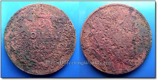 Thick Encrustation Was Removed To Reveal Ugly Pitting Caused by Long-Time Corrosion On Coin's Surface