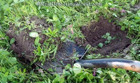 Removing the Turf Square with Coin in It